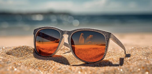 Photo of sunglasses on beach